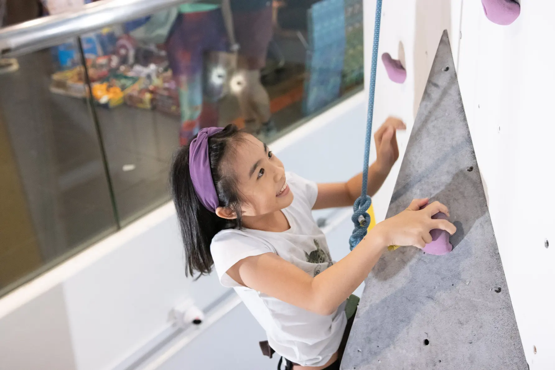 NTUC Club Quadrennial Report - Indoor Rock Climbing facility at Downtown East